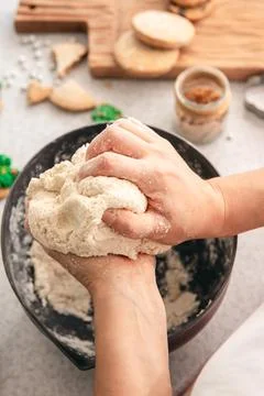 Hands knead thick dough on the kitchen table, decorated with festive decorations for Christmas and New year, baking at home. xkwx christmas food pastry dough homemade flour hand cooking gingerbread baking traditional kitchen table woman holiday xmas cookie sweet sugar bake cook home cake dessert biscuit delicious bowl celebration domestic person kneading lifestyle handmade fresh tasty recipe natural organic nutrition baked ingredient bakery chef dish preparation culinary festive
