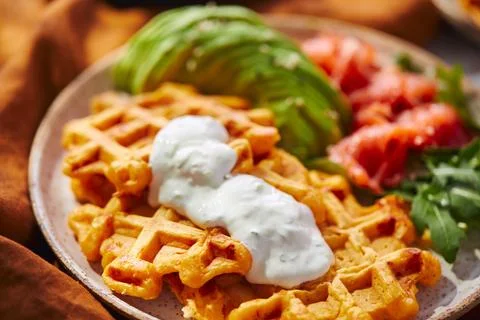 Hearty sweet potato or pumpkin waffles with avocado, salmon, arugula and sauce xkwx waffle salmon sweet potato pumpkin breakfast avocado healthy food delicious meal dinner lunch tasty fish morning dish snack homemade diet plate fresh green vegetable brunch cooking background gourmet salad smoked baked epicure bread toast sauce belgian healthy breakfast wafer fat eating organic fast food nourishment smoked salmon herb belgian waffles ketogenic arugula