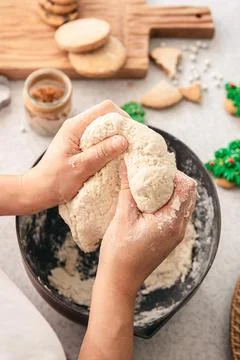 Hands knead thick dough on the kitchen table, decorated with festive decorations for Christmas and New year, baking at home. xkwx christmas food pastry dough homemade flour hand cooking gingerbread baking traditional kitchen table woman holiday xmas cookie sweet sugar bake cook home cake dessert biscuit delicious bowl celebration domestic person kneading lifestyle handmade fresh tasty recipe natural organic nutrition baked ingredient bakery chef dish preparation culinary festive