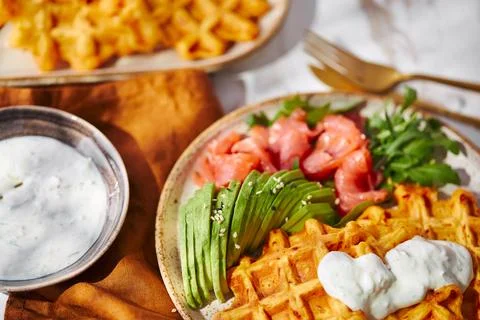 Hearty sweet potato or pumpkin waffles with avocado, salmon, arugula and sauce xkwx waffle salmon sweet potato pumpkin breakfast avocado healthy food delicious meal dinner lunch tasty fish morning dish snack homemade diet plate fresh green vegetable brunch cooking background gourmet salad smoked baked epicure bread toast sauce belgian healthy breakfast wafer fat eating organic fast food nourishment smoked salmon herb belgian waffles ketogenic arugula