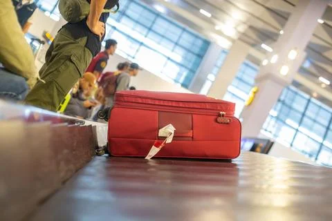 The luggage belt with suitcases being delivered to the passengers at the arrival terminal xkwx adventure air travel airport arrival background bag baggage belt blur blurred building business carousel cart city claim design domestic equipment holidays industrial industry interior international luggage modern problem protest public service staff strike terminal tourism transfer transit transport transportation trip trolley waiting work