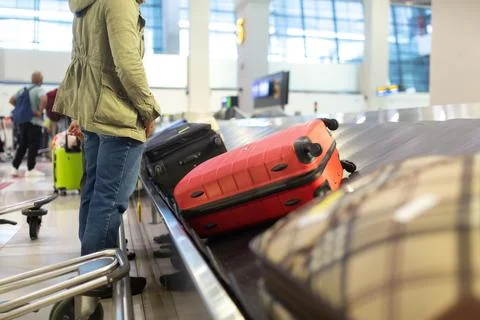 The luggage belt with suitcases being delivered to the passengers at the arrival terminal xkwx adventure air travel airport arrival background bag baggage belt blur blurred building business carousel cart city claim design domestic equipment holidays industrial industry interior international luggage modern problem protest public service staff strike terminal tourism transfer transit transport transportation trip trolley waiting work