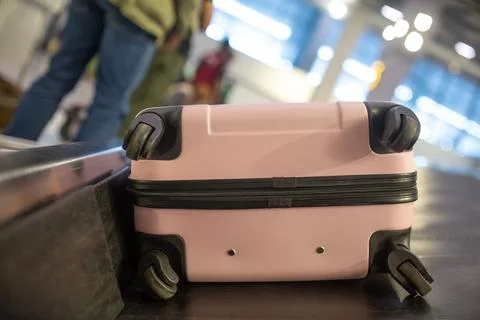 The luggage belt with suitcases being delivered to the passengers at the arrival terminal xkwx adventure air travel airport arrival background bag baggage belt blur blurred building business carousel cart city claim design domestic equipment holidays industrial industry interior international luggage modern problem protest public service staff strike terminal tourism transfer transit transport transportation trip trolley waiting work