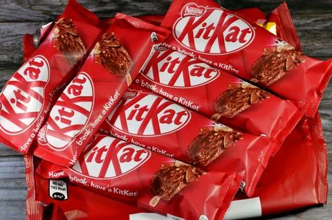 Cairo, Egypt, December 3 2023: KitKat stick ice cream vegetable fat vanilla, wafer caramel, chocolate coated with milk and wafer pieces, chocolate pieces from Nestle, Kit Kat chocolate vanilla stick xkwx brand break cacao candy caramel chocolate chunk coated cocoa cold confection confectionery cracked cream creamy creme dairy delicious dessert frozen glucose have ice ice cream icecream illustrative editorial kat kit kit kat kitkat milk nestle nestl nut peanut refreshing refreshment rowntree snack stick sugar sundae sweet tasty temptation trademark vanilla wafer waffle