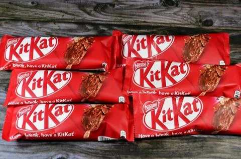 Cairo, Egypt, December 3 2023: KitKat stick ice cream vegetable fat vanilla, wafer caramel, chocolate coated with milk and wafer pieces, chocolate pieces from Nestle, Kit Kat chocolate vanilla stick xkwx brand break cacao candy caramel chocolate chunk coated cocoa cold confection confectionery cracked cream creamy creme dairy delicious dessert frozen glucose have ice ice cream icecream illustrative editorial kat kit kit kat kitkat milk nestle nestl nut peanut refreshing refreshment rowntree snack stick sugar sundae sweet tasty temptation trademark vanilla wafer waffle