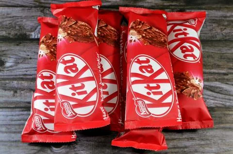 Cairo, Egypt, December 3 2023: KitKat stick ice cream vegetable fat vanilla, wafer caramel, chocolate coated with milk and wafer pieces, chocolate pieces from Nestle, Kit Kat chocolate vanilla stick xkwx brand break cacao candy caramel chocolate chunk coated cocoa cold confection confectionery cracked cream creamy creme dairy delicious dessert frozen glucose have ice ice cream icecream illustrative editorial kat kit kit kat kitkat milk nestle nestl nut peanut refreshing refreshment rowntree snack stick sugar sundae sweet tasty temptation trademark vanilla wafer waffle