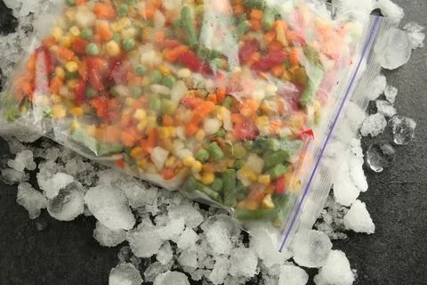 Zip bag with different frozen vegetables and ice on grey table, top view xkwx asparagus assortment background bag carrot cold cooking corn cut delicious diet different eating flat food freeze freezer freezing fresh frost frozen grey healthy homemade ice ingredient kitchen lay meal mix mixed natural nutrition object organic peas pepper product raw storage table tasty top various vegan vegetables vegetarian view vitamin zip