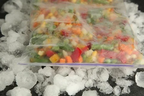 Zip bag with different frozen vegetables and ice on table, closeup xkwx asparagus assortment background bag carrot closeup cold cooking corn cut delicious diet different eating food freeze freezer freezing fresh frost frozen grey health healthy homemade ice ingredient kitchen meal mix mixed natural nutrition object organic peas pepper product raw storage table tasty various vegan vegetable vegetables vegetarian vitamin zip