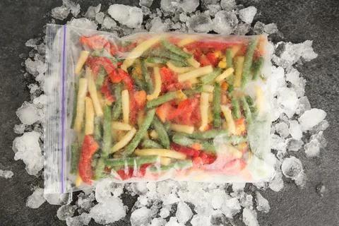 Zip bag with different frozen vegetables and ice on grey table, top view xkwx asparagus assortment background bag carrot cold cooking corn cut delicious diet different eating flat food freeze freezer freezing fresh frost frozen grey health healthy homemade ice ingredient kitchen lay meal mix mixed natural nutrition object organic pepper product raw storage table tasty top various vegan vegetables vegetarian view vitamin zip