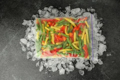 Zip bag with different frozen vegetables and ice on grey table, top view xkwx asparagus assortment background bag carrot cold cooking corn cut delicious diet different eating flat food freeze freezer freezing fresh frost frozen grey health healthy homemade ice ingredient kitchen lay meal mix mixed natural nutrition object organic pepper product raw storage table tasty top various vegan vegetables vegetarian view vitamin zip