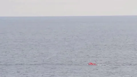 25mm artillery mount Mark 38 Shooting at sea targets, Huge bullets tear down the Video stock 120968235
