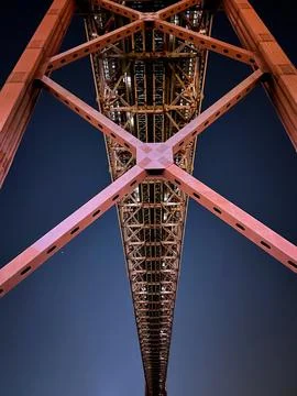 25th April Bridge construction view from below against the night sky in Lis.. Stock Photos