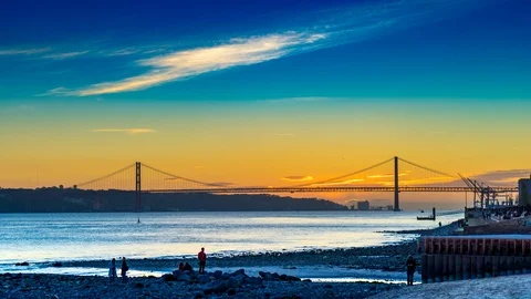 The 25th of April Bridge in the light of setting sun in Lisbon Stock Footage 90609197