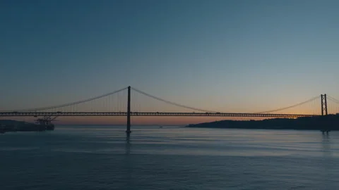 The 25th of April Bridge in Lisbon at sunset, shot from a drone Video stock 327673435