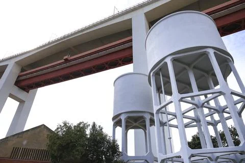 The 25th April Bridge structure over water reservoirs Stock Photos
