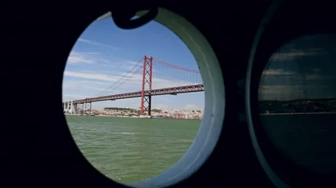 25th of April Bridge from the window of the ship Lisbon Portugal Stock Footage 64578352