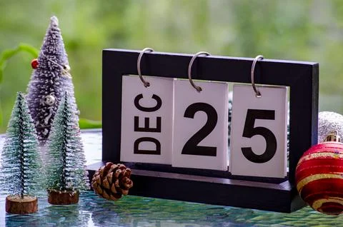 25th December table calendar with small Christmas trees decoration. Christm.. Stock Photos