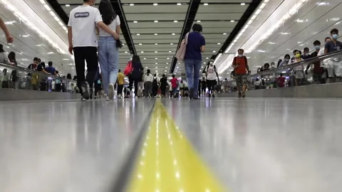 26 4 2021 busy crowd of men and women with face mask walking in subway in Cen Stock Footage 153085200