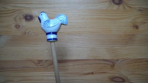 26 Decorative element - ceramic shape of rooster moving on wooden background Stock Footage 93070720