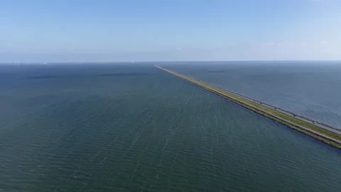 26 km long dam in the middle of the IJsselmeer area, between Lelystad and Stock Footage 310998621