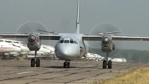 An-26 (Nato Name:: Curl). Close-up of  airplane An-26 and rotating screws. Stock Footage 114160780
