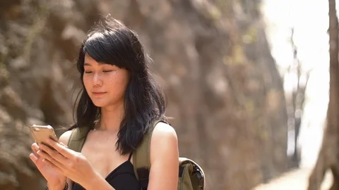 26 young lady chatting on mobile phone while travelling on vacation Stock Footage 105295642