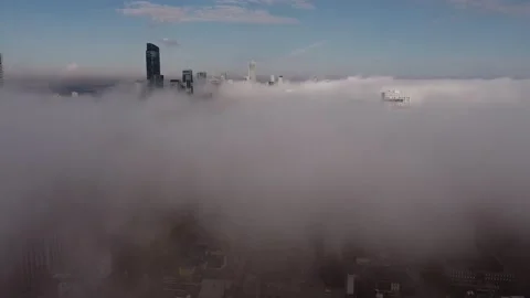 2.7 aerial flight backwards looking at Toronto skyline through fog and then pan  Stock Footage 149896878