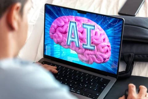  27 September 2023: Artificial intelligence on a laptop computer, man in f... Stock-Fotos
