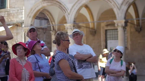 27 - Travel Guise explaining some historical artefacts Stock Footage 134075222