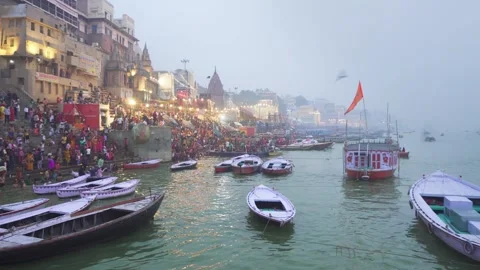 27/11/2023: People take holy dip in river Ganges, Varanasi, India Video stock 271728126