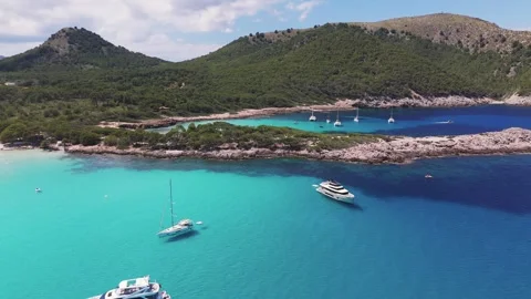 Anchored Boats in Bay, Aerial Drone Footage, Cala Agulla Beach, Mallorca, Spain Anchored Boats in Bay, Aerial Drone Footage, Cala Agulla Beach, Mallorca, Spain