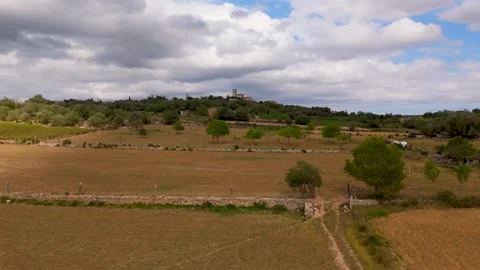 Flight over farmland towards the town of Ariany, Mallorca - Aerial Drone Flight over farmland towards the town of Ariany, Mallorca - Aerial Drone