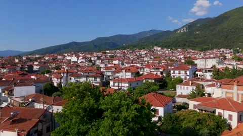 Drone Gliding Close Over Litochoro Rooftops Towards Mount Olympus, Greece
