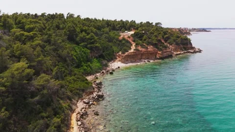 Close Pass by Coast, Aegean Lagoon, Kassandra, Halkidiki, Greece - Aerial Drone Close Pass by Coast, Aegean Lagoon, Kassandra, Halkidiki, Greece - Aerial Drone