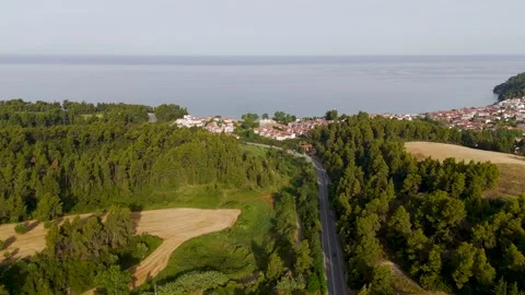 Approaching the coastal village of Siviri, Halkidiki, Greece - Aerial Drone Approaching the coastal village of Siviri, Halkidiki, Greece - Aerial Drone