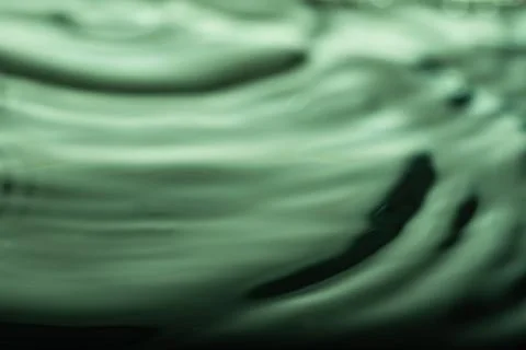279.Green-Tinted Liquid Surface with Ripple Distortion Illustrazione stock