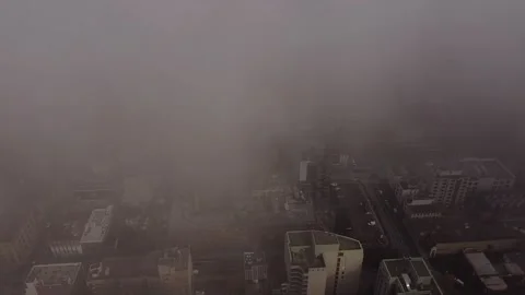 2.7K aerial flight looking down to road below flying backwards while panning up  Stock Footage 149896902