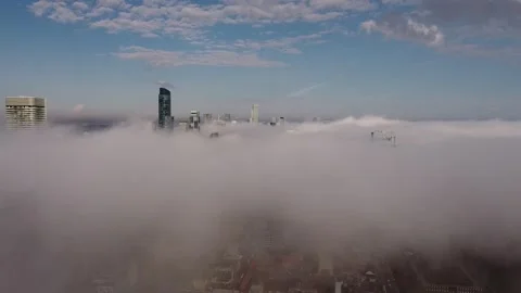 2.7K aerial flight over dense fog looking at Toronto skyline Stock Footage 149896891