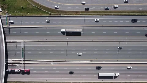 2.7K aerial flight parallel to 16 lanes of traffic on highway 401 near Toronto w Stock Footage 149995958