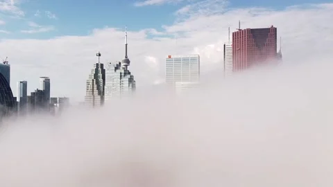 2.7K aerial flight rotating in dense fog looking at Toronto skyline Stock Footage 149895802