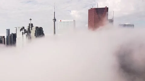 2.7K aerial flight through dense fog looking at Toronto skyline Video stock 149895813