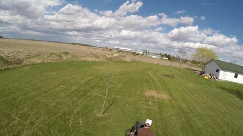 2.7k aerial view of guy mowing lawn Stock Footage 49797857