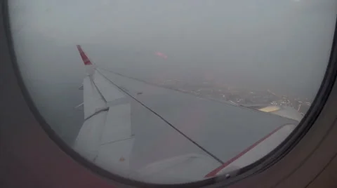 2.7K. Airplane wing out of window on blue sky background, Full HD. 2704x1524 Stock Footage 40503419