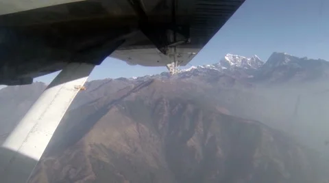2.7K. Airplane wing out of window on blue sky background, Full HD. 2704x1524 Stock Footage 47809311