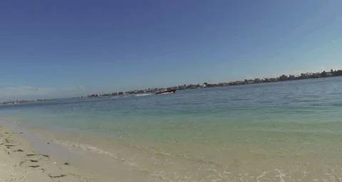 2.7K Boat passing by shoreline 스톡 동영상 34795014