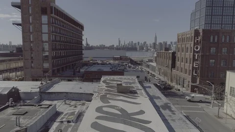 2.7K Brooklyn Roofs with Grafitti Manhattan Skyline Stock Footage