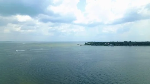 2.7K Drone Backing Up Over Lake With Jetskis and Boats Stock Footage 109299497