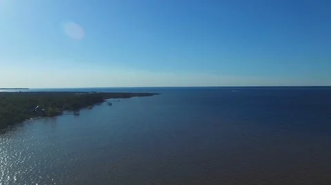 2.7K Drone Backing Up Over Water Along Forest Video stock 109356616