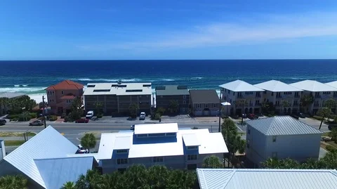 2.7K Drone Flying Over Homes and Road Out to Ocean Stock-Footage 109230751