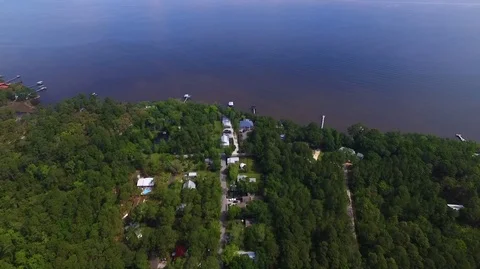 2.7K Drone Flying Over Small Wooded Neighborhood on the Water 库存影片 109356055